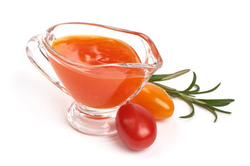 Sweet chili sauce in a gravy boat, isolated on white background