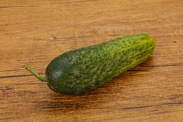 Green ripe fresh cucumber over background