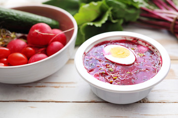 Beet soup in a plastic bowl. Dietary catering with home delivery. An appetizing dish of a balanced diet served in a plastic disposable dish.