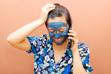 Woman wearing a blue beauty mask