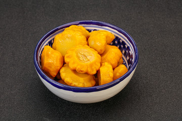Marinated yellow patisson in the bowl