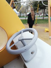 Park, square with playgrounds fenced with ribbons during the coronavirus, quarantine, pandemic. Children on playgrounds, dogs in parks and squares.