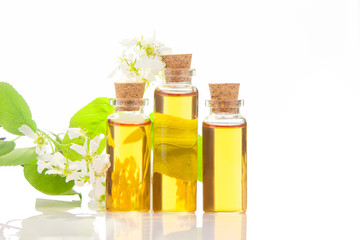 Essence of flowers on table in beautiful glass jar