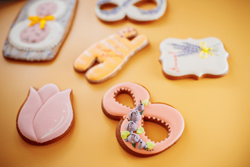 gingerbread cookies with different shapes on a yellow background