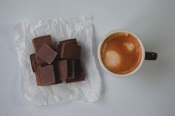 Coffee and chocolate on a white background