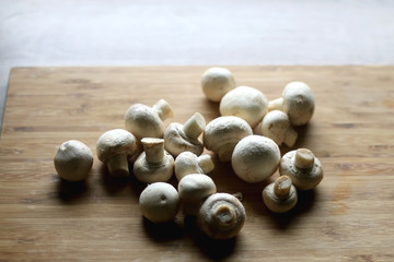 Portobello mushrooms on a cutting board. Selective focus.