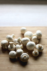 Portobello mushrooms on a cutting board. Selective focus.