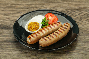 Grilled natural pork sausages with sauce