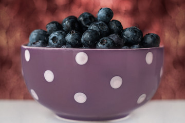 a cup of blueberries viewed for breackfast