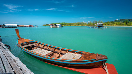 Naklejka na ściany i meble Wooden Boat With Sea View