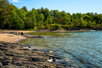 Panoramic early autumn view of rocky seashore of Hovedoya island in Oslofjord harbor near Oslo,...