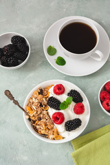 Yogurt with muesli, blackberries and raspberries