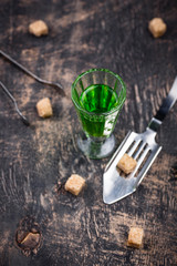 Glass of absinthe with cane sugar