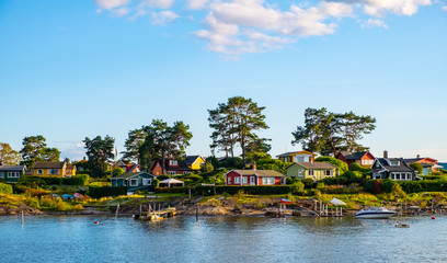Panoramic view of Nakholmen island on Oslofjord harbor near Oslo, Norway, with summer cabin houses...