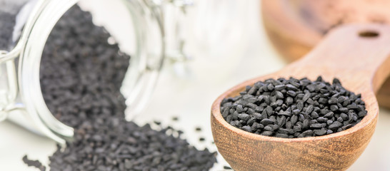 Black cumin seeds - natural antioxidant - closeup - banner design