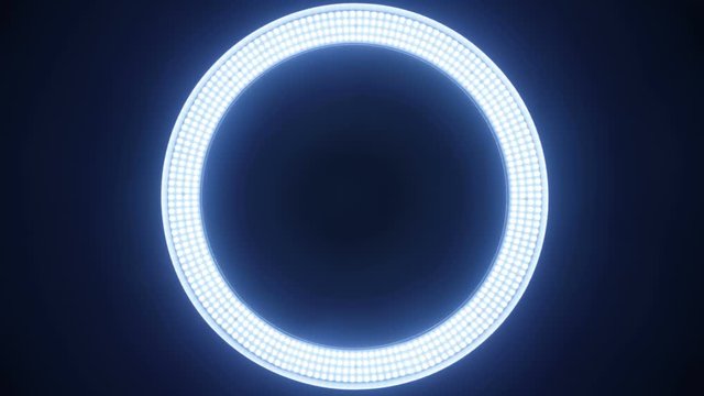 The ring from LED in the lamp lights up in different modes on a black background