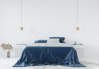Bedroom interior with a blue bedspread against a white wall background