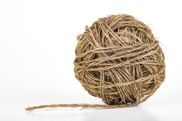 A ball of coiled string for gardening. Cord for tying plants.
