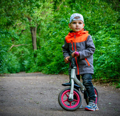 child with bike in the park