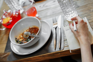vegetarian cream soup stands on a wooden table with appliances
