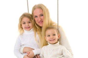 Happy Family of Mother and Two Kids Sitting Together on Rope.