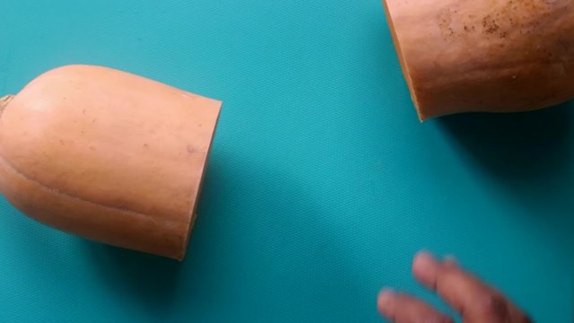 Flat lay person hands preparing pumpkin butternut squash - 15 sec