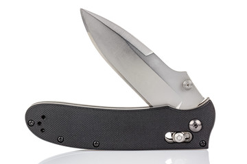 Open folding pocket knife with satin blade and textured black composite plastic cover plates on steel handle isolated on white background with reflection on glossy surface. Pocket knife close-up image