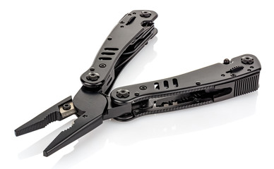 Open pliers of black multi tool knife isolated on white background with reflection on glossy surface. Multipurpose knife close-up image