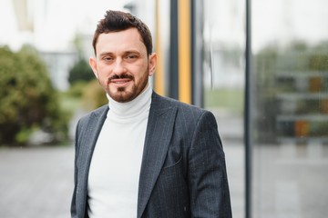 Fototapeta premium portrait of a confident mature businessman standing outside