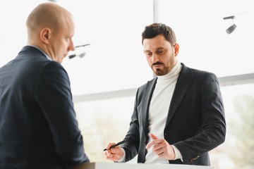 two businessmen sign a cooperation agreement. Successful business concept