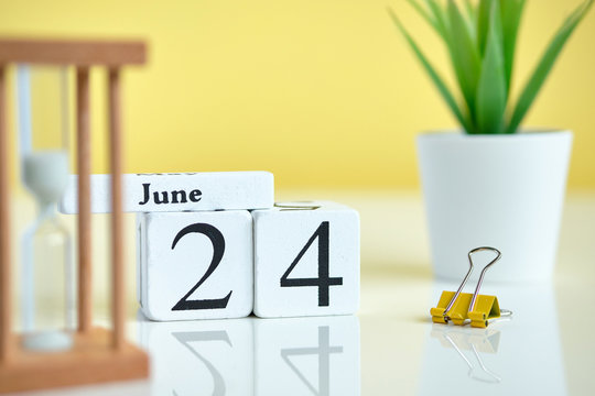 24 twenty fourth day june Month Calendar Concept on Wooden Blocks.