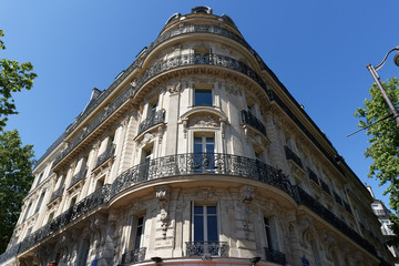 Obraz premium Traditional French house with typical balconies and windows. Paris.