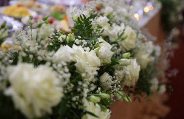Wedding decor of roses on the arch.