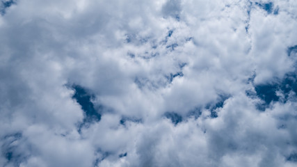 Dark blue sky with big white grey clouds in the morning. Background