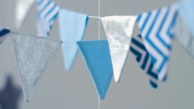 Baby Mobile With Different Animals Hanging Over The Crib Of A Newborn Baby In The Bedroom On A White Background