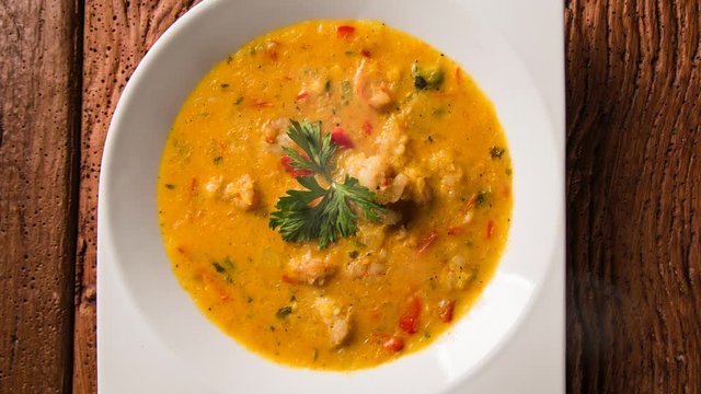 shrimp bobo with smoke. Brazilian dish of shrimp in a pure of manioc meal and coconut milk. Bobo de camarao.