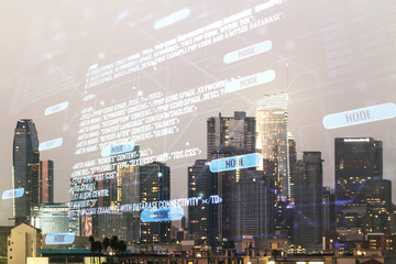 Double exposure of abstract creative programming illustration on Los Angeles office buildings background, big data and blockchain concept