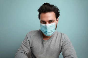 Portrait of young professional employee, staying safe, wear medical mask. Covid19, virus, health and medicine concept. 
