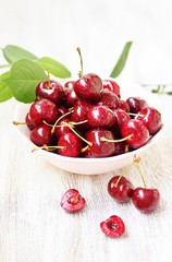 juicy ripe sweet cherries in a cup. close-up, blurred focus. copy space