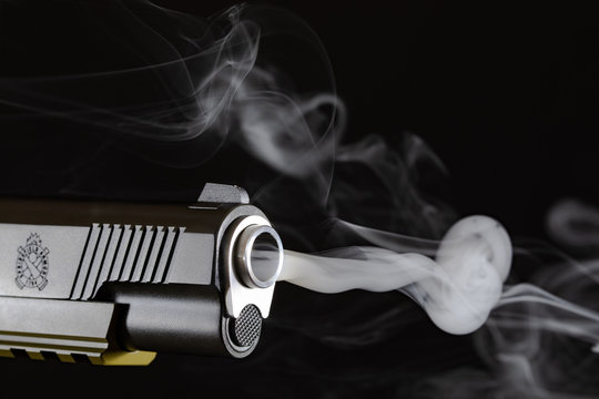 Springfield Operator 45 Cal with gun smoke