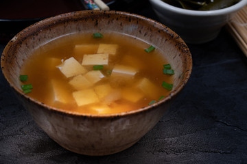 Vegan japanese miso soup with tofu in ceramic bowl