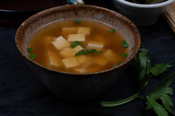 Vegan japanese miso soup with tofu in ceramic bowl