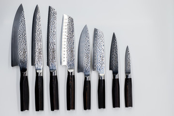 Japanese damascus kitchen knifes on the white backround