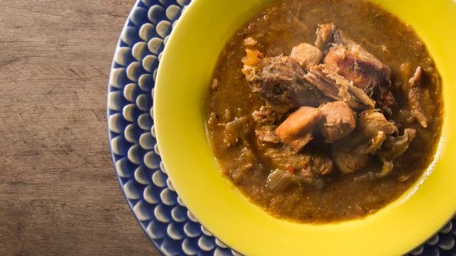 Fish pir&atilde;o with pieces of chicken from angola. Top view with smoke.