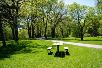 Picnic tables along trails inside of Clifton French Regional Park in Plymouth Minnesota