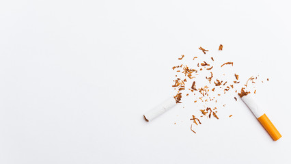 31 May of World No Tobacco Day, no smoking, close up of broken pile cigarette or tobacco STOP symbolic on white background with copy space, and Warning lung health concept