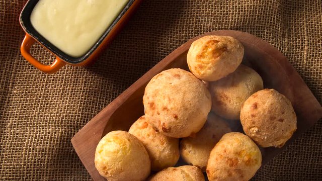 Cheese bread or cheese buns and cream cheese. Traditional brazilian food with smoke. 