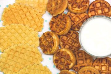 waffles with milk on a white-turquoise background copy space