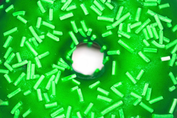 Green donut close-up copy space White background