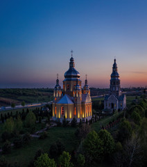 Fototapeta na wymiar Zubra, Lviv district, UKRAINE - may 2020: The beautiful church is illuminated at night